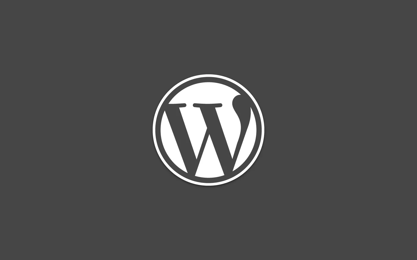 The WordPress logo on a dark background